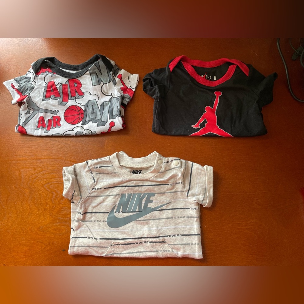 Two Jordan Onesies and Nike Short one piece